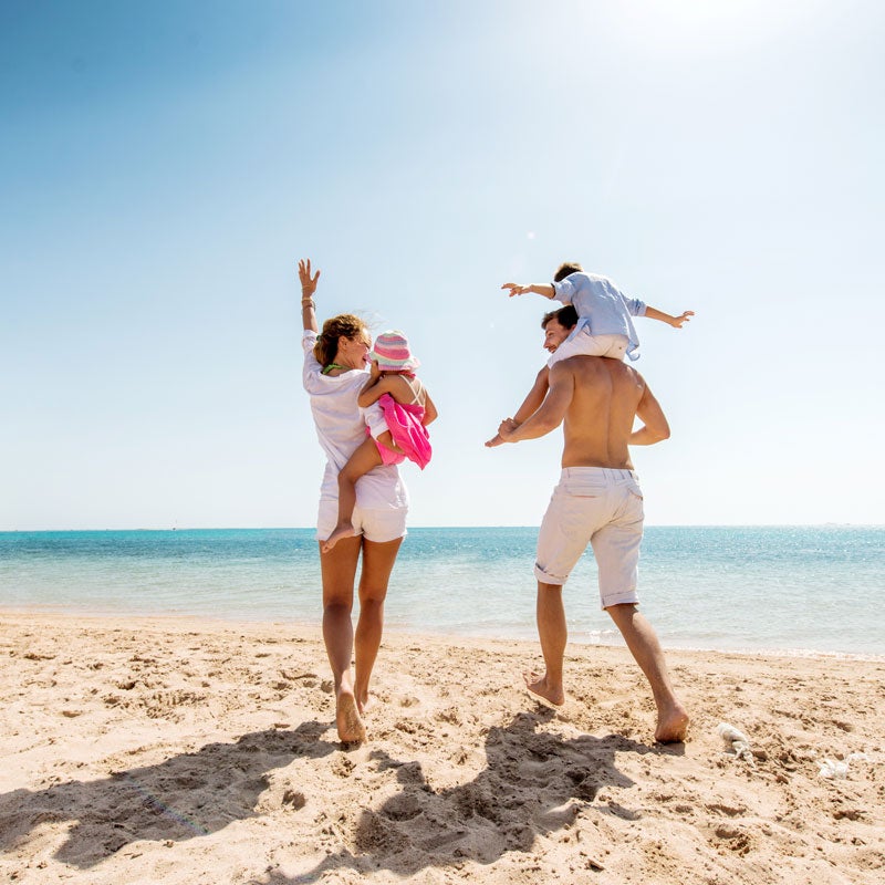 Family Enjoying On A Beach After Their Allergy Testing In Jupiter, FL