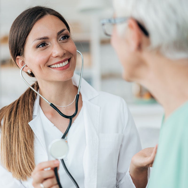 An ENT Specialist talking to an elderly patient about his health in Jupiter, FL
