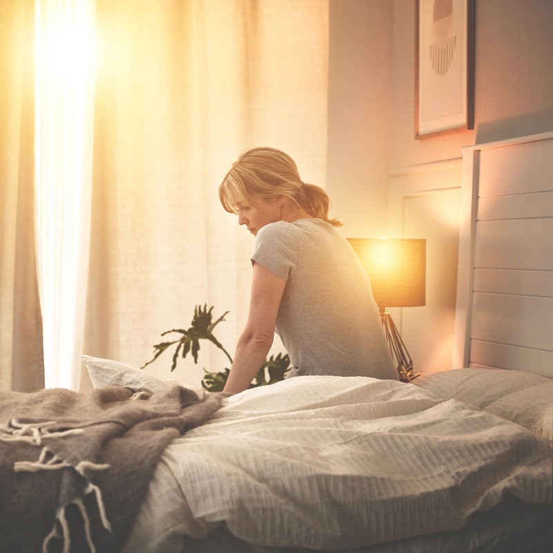 lady sitting on bed