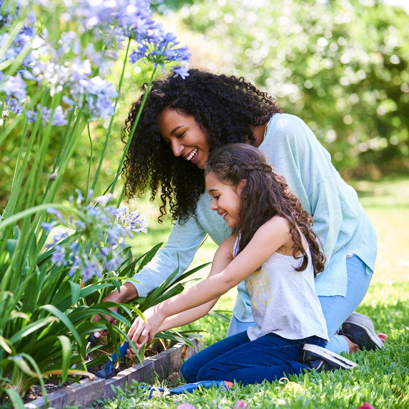 mother and daughter in flowers