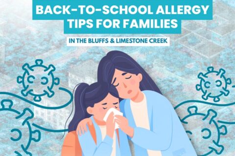 Mothers comforts daughter with allergies, holding tissue