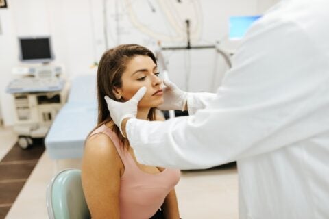 A woman consulting with a doctor about her sinus issues in Jupiter, FL.
