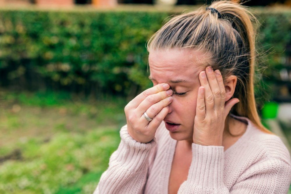 Women having headache and sinus pain